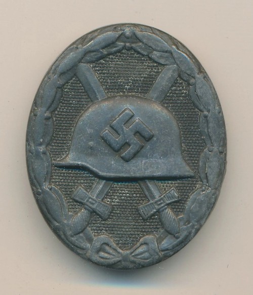 SOLD - Maker Marked Black Wound Badge in Zinc