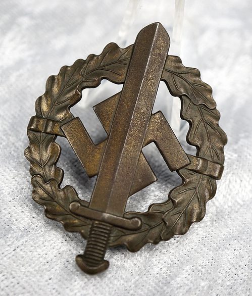 SOLD - numbered SA sports badge in bronze