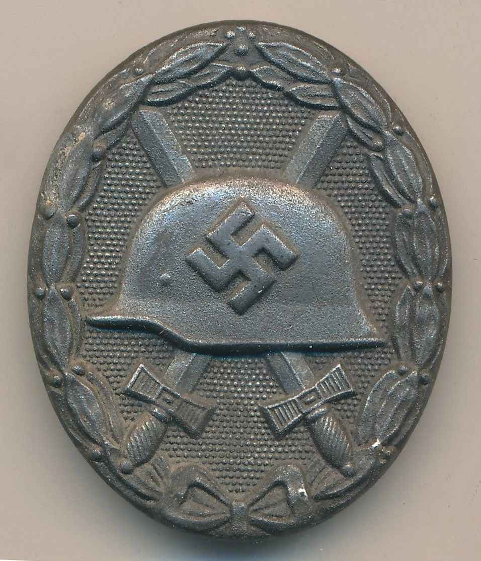 SOLD - Maker Marked Silver Wound Badge