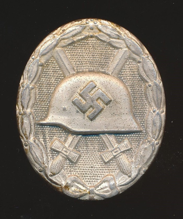 SOLD - Maker Marked Silver Wound Badge